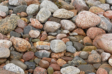 Stones and pebbles on the beach of the baltic sea, full frame background