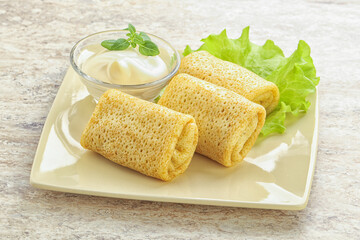 Stuffed pancakes with meat and cream