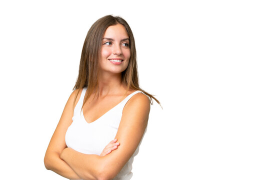 Young Pretty Woman Over Isolated Background With Arms Crossed And Happy