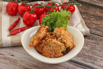 Fried salmonn cutlet in the bowl