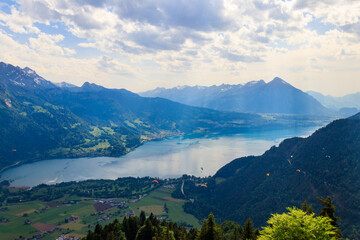 Breathtaking aerial view of Lake Thun and Swiss Alps from Harder Kulm viewpoint, Switzerland