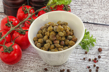 Marinated green capers in the bowl
