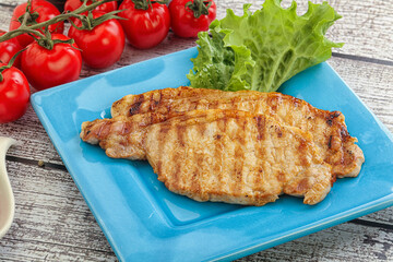 Grilled pork steak with ketchup