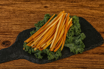 Chechel cheese sticks over board