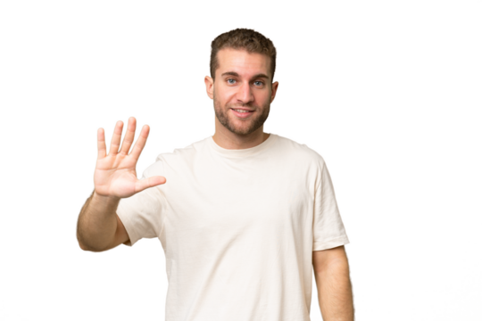 Young handsome caucasian man isolated on green chroma background counting five with fingers