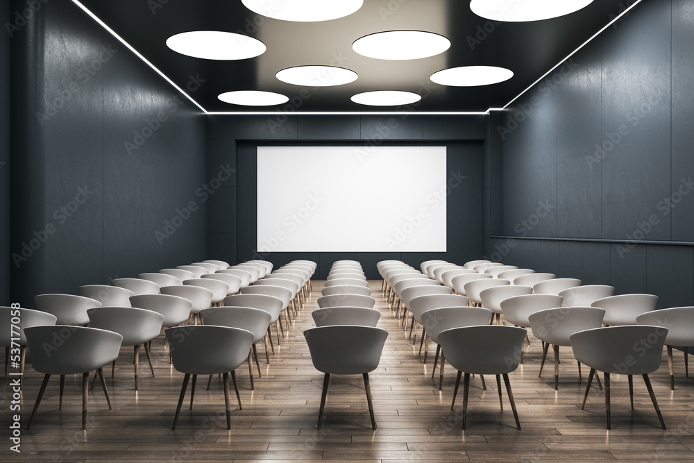 Poster front view on blank white wall board with space for your logo or text on dark wall in empty auditori