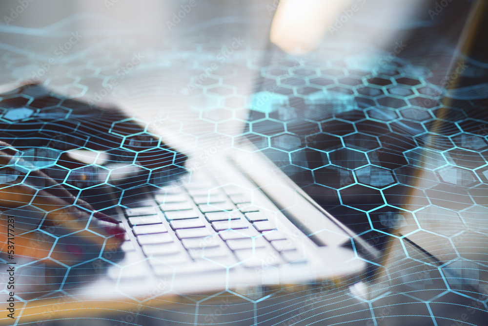 Poster Close up of hands using laptop keyboard with creative blue hexagonal background. Technology, communication and network concept. Double exposure.