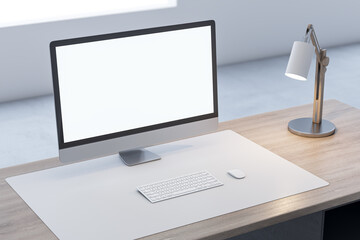 Close up of wooden office desk top with empty white computer monitor and mock up place for your advertisement, lamp and keyboard on blurry background. 3D Rendering.