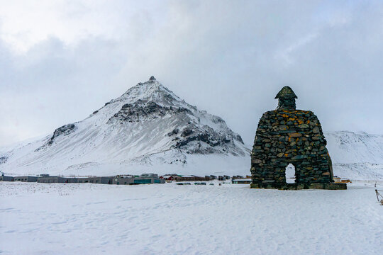 Saga of Barour Snaefellsas Statue at Arnarstapi town during winter snow everning at Arnarstapi , Sn&aelig;fellsnes peninsula in Iceland : 15 March 2020