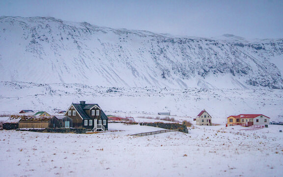 Arnarstapi , Beautiful fishing village buildings and nature near Mt. Stapafell during winter snow everning at Arnarstapi , Sn&aelig;fellsnes peninsula in Iceland : 15 March 2020