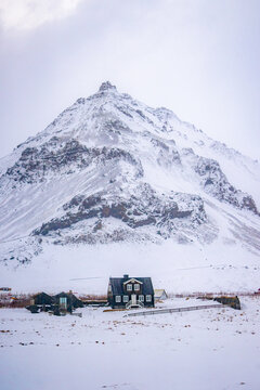 Arnarstapi , Beautiful fishing village buildings and nature near Mt. Stapafell during winter snow everning at Arnarstapi , Sn&aelig;fellsnes peninsula in Iceland : 15 March 2020