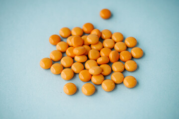 various medicines on a blue paper background