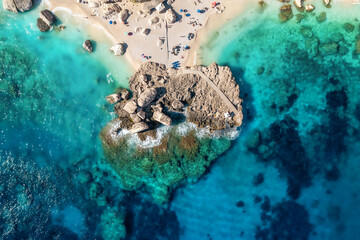 Aerial view beautiful seascape with stone pier and sandy beach on a sunny day top view
