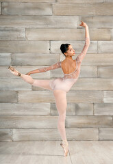 Ballerina doing arabesque on pointe