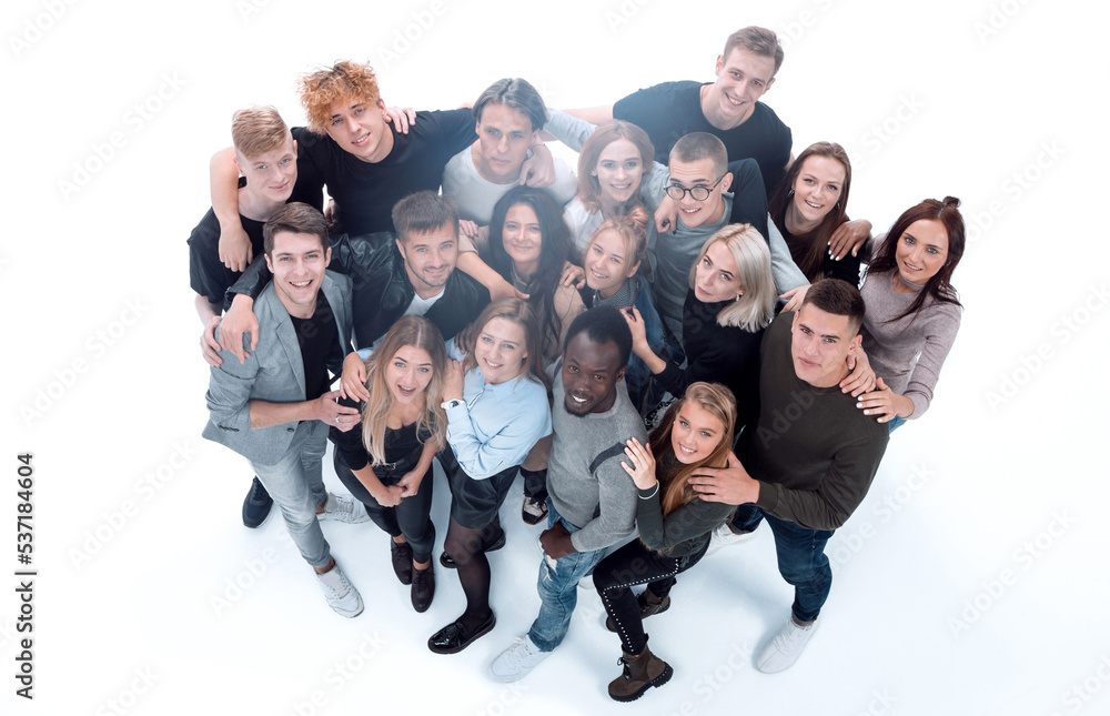 Wall mural group of happy young people pointing at the camera.