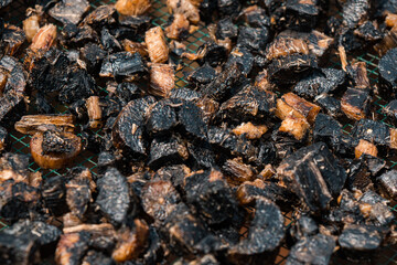Drying thiwul under the hot sun, a traditional brown & black food from Gunung Kidul, Indonesia that comes from cassava tubers