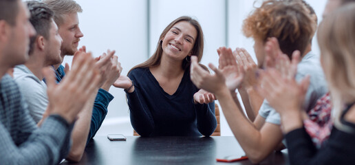 group of ambitious young business people sitting at an office Desk