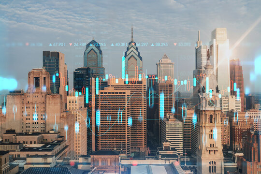 Aerial panoramic cityscape of Philadelphia financial downtown, Pennsylvania, USA. City Hall Clock Tower, sunrise. Forex candlesticks and bar graph hologram. The concept of internet trading, brokerage