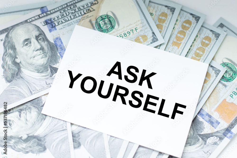 Poster a white card with the text ask yourself on the table