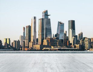 Empty concrete dirty embankment on the background of a beautiful New York city skyline at daytime,...