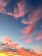 sunset colors reflected onto clouds at dusk
