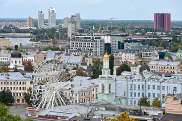 Top view of the Ferris wheel and houses in the city center of Kyiv 