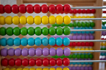 
School abacus with colorful beads, closeup view, copy space. Kids learning, kids math class concept