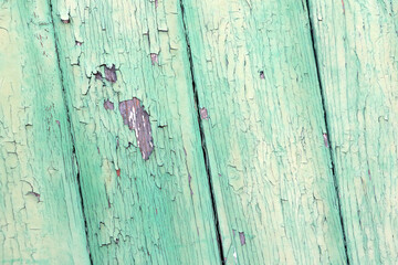 Old peeling paint on a wooden background, wood texture.