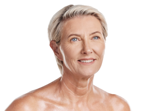 Beautiful mature caucasian woman posing topless and isolated against a pink background in a studio. Happy senior woman with glowing skin. Good skincare and a healthy routine is self care for your skin