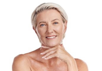 Portrait of a happy smiling mature caucasian woman looking positive and cheerful while posing topless in a studio against purple copyspace background. Older woman doing her skincare routine