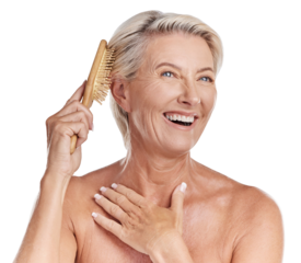 One mature caucasian woman brushing  her hair to remove knots and tangles against a purple studio background. Happy older woman styling her hair