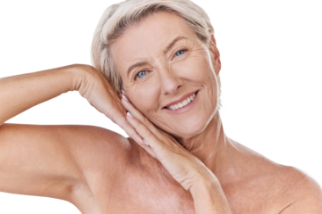 Portrait of a happy mature caucasian woman relaxing with a hand on her face against a pink background. Smiling senior woman resting, caring for her skin while doing a skincare routine