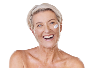 Portrait of one happy mature caucasian woman posing topless against a purple copyspace background. Ageing woman applying cream, moisturiser, sunblock during a skincare routine in a studio