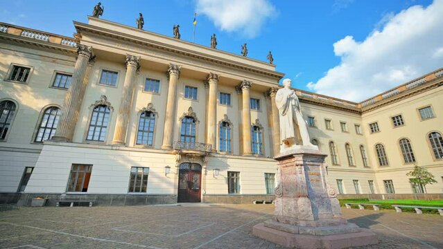 View of Humboldt University in Berlin downtown, Germany. Hermann von Helmholtz statue on the foreground