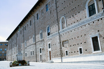 Urbino, (PU), Italy - August 10, 2022: Piazza del Rinascimento with Palazzo Ducale, Urbino, Pesaro...