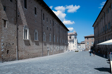 Urbino, (PU), Italy - August 10, 2022: Piazza del Rinascimento with Palazzo Ducale, Urbino, Pesaro...