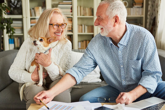 Happy senior couple talking about retirement savings