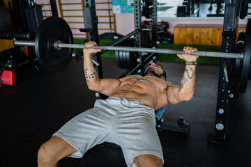 High angle view of a man doing bench press exercises