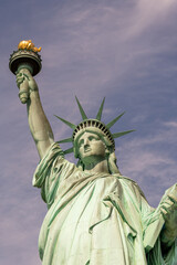 Fototapeta na wymiar Statue of Liberty front view with torch and declaration of independence