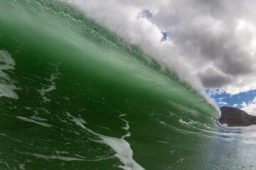 huge crashing wave with stormy sky
