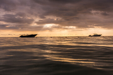 boat on the sea at sunset