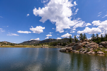 Naklejka na ściany i meble dramatic sky over a lake in the mountains