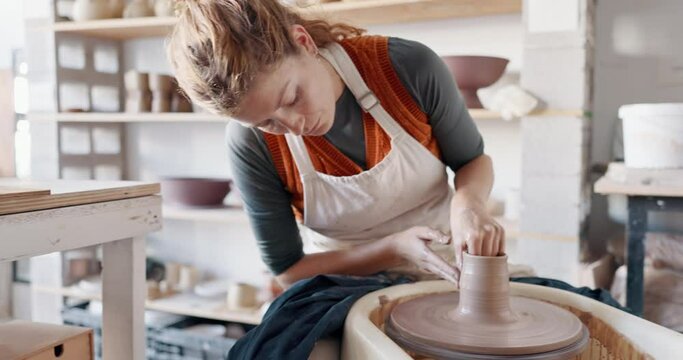 Pottery, woman creative and mold clay art piece for class, hobby or relax in workshop or studio. Creativity, girl student or female sculptor use wheel spinning, shape art or ceramic design workspace.