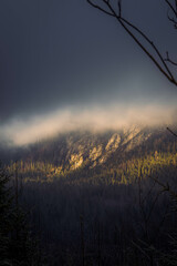 Mountain lit by afternoon sunlight during a cold winter day at Morskie Oko, Poland.
