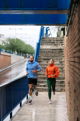 Runners Working Out in Rainy Day