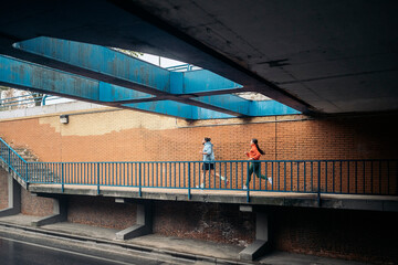 Runners Exercising Outdoors in Rainy Day