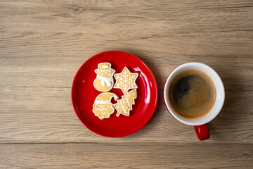 Merry Christmas with homemade cookies and coffee cup on wood table background. Xmas eve, party, holiday and happy New Year concept