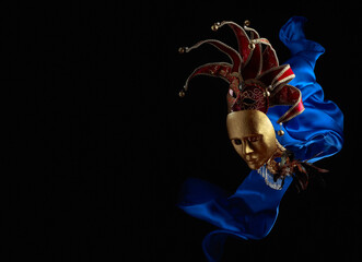 Old carnival masks with flutters blue cloth.