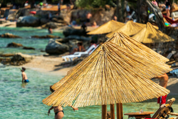 Parasol on a beach by the sea in beautiful vacation weather