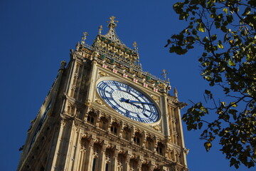 Fototapeta na wymiar Low angle view of the Elizabeth Tower on a clear sunny day in fall. Ideal Westminster background, British screensaver